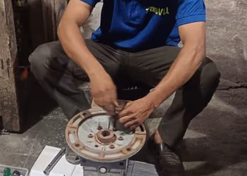 Technician explaining a gearbox assembly to a customer