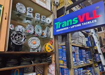 OEM-labelled gearbox and chain boxes on warehouse shelving